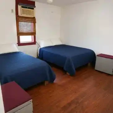 Fire House Lodge bedroom with two full beds