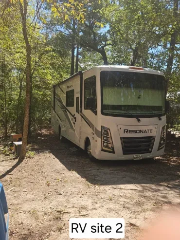 RV Site 2 — Resonate Class A motorhome among trees